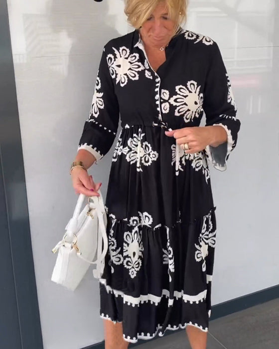 Kjole med blomstertrykk med 3/4-ermer