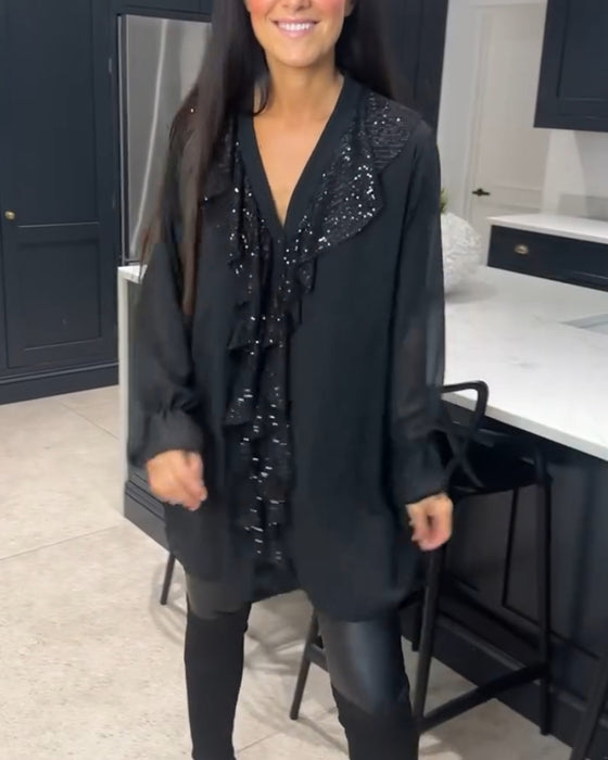 Bluse med volanger og elegant stil