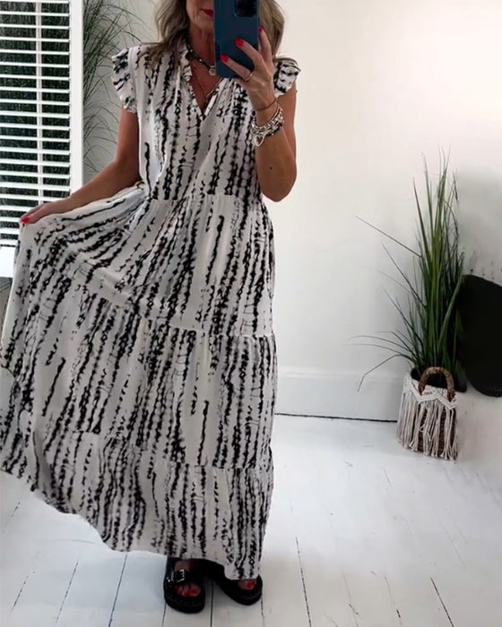 Flueermet kjole med V-hals og blomstertrykk