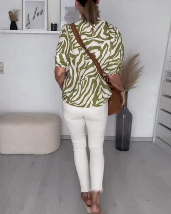 Bluse med rund hals med sebratrykk