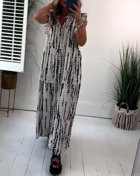 Flueermet kjole med V-hals og blomstertrykk