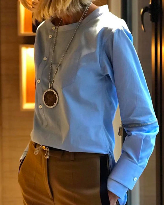 Ensfarget uregelmessig topp med knapper