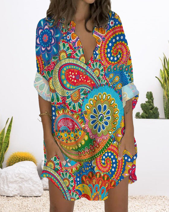 Kneppet kjole med lange ermer og lomme