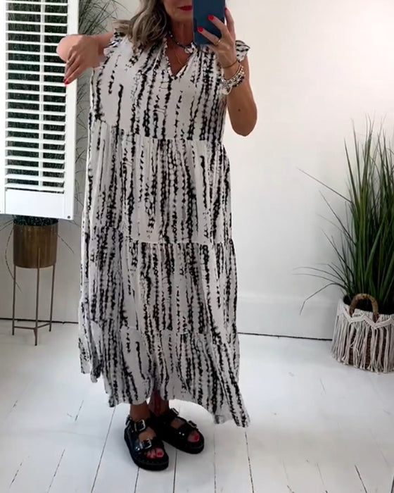 Flueermet kjole med V-hals og blomstertrykk