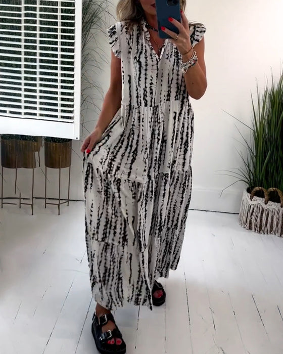 Flueermet kjole med V-hals og blomstertrykk