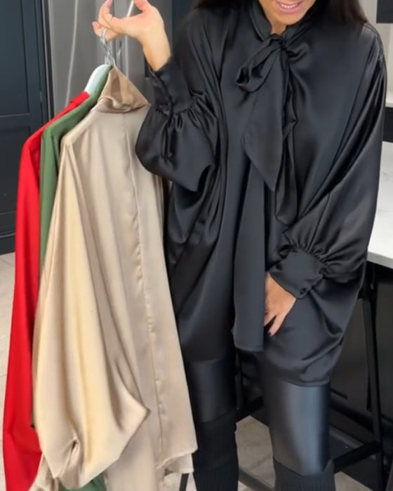 Båndkrage ensfarget og elegant bluse