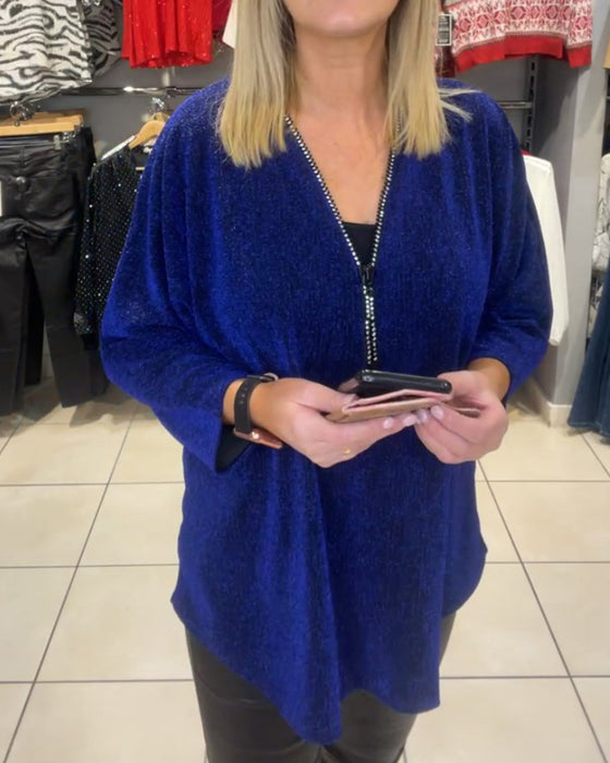 Løs topp med lange ermer og glidelås