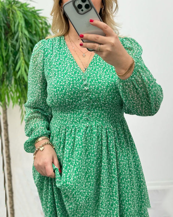 Elegant kjole med trykk med knapper