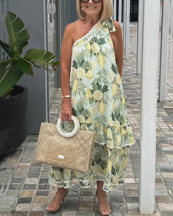 Kjole med blomstertrykk på én skulder