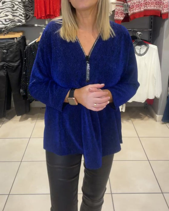 Løs topp med lange ermer og glidelås