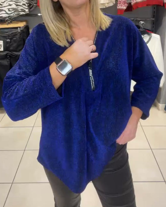 Løs topp med lange ermer og glidelås