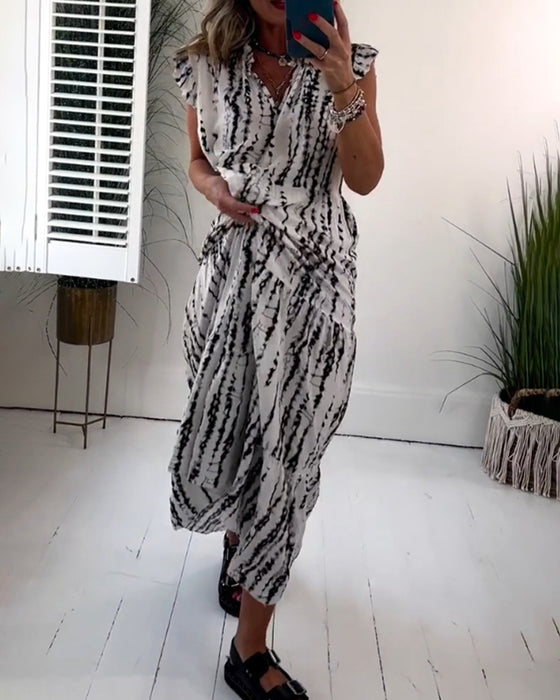 Flueermet kjole med V-hals og blomstertrykk